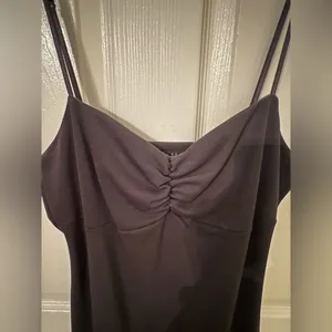 Black dress with ruffles at the bottom. thumbnail 4