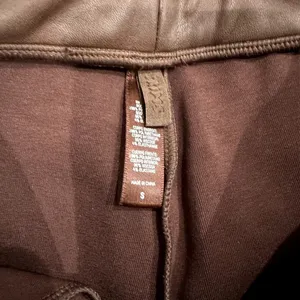 Skims Faux Leather Biker Shorts in Cocoa Brown, Size S​​​​ thumbnail 3