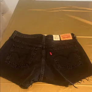 Levi's Black Distressed Cutoff Jean Shorts thumbnail 2