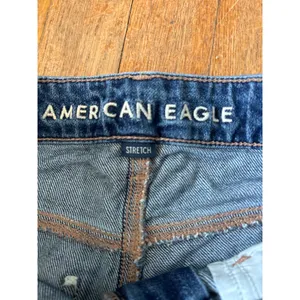 American Eagle Super High Rise Baggy Wide Leg Jeans Medium Wash Cut Off Hem 0 S thumbnail 2