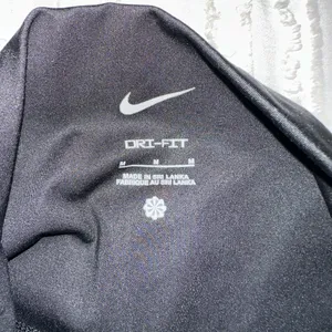 Nike Women's Black Leggings with White Logo thumbnail 4