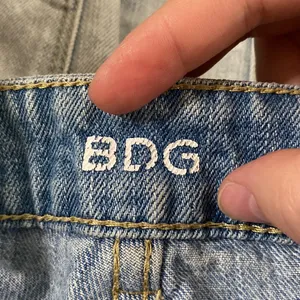 BDG UO Super high rise cheeky denim shorts light wash distressed fringed hem 29 thumbnail 7