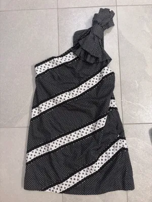 Maeve One-Shoulder Embellished Mini Dress from Anthropologie, featuring a black and white patterned design with a decorative shoulder bow. thumbnail 2