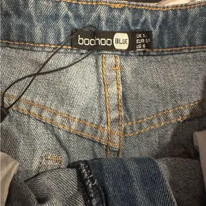 Boohoo Denim Mini Skirt with Red and White Accents thumbnail 2