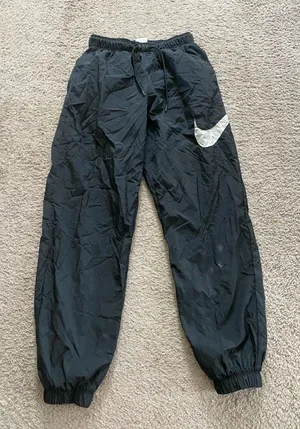 Nike Black Unisex Windbreaker Joggers with White Swoosh Accent thumbnail 1