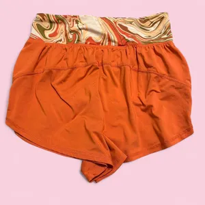 Orange and multi-coloured swirl print shorts with elastic waistband and drawstring thumbnail 2