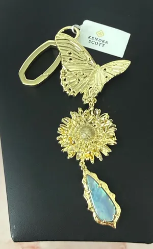 Kendra Scott | Gold Butterfly & Sunflower Bag Charm/Keychain w/Blue Opal Charm thumbnail 1