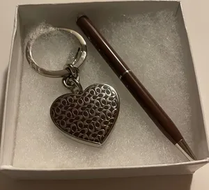 Coach charm & Coach pen thumbnail 1