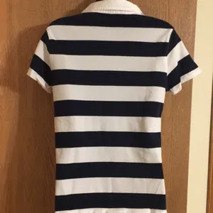Izod women’s cute navy and white striped golf shirt. Size M. EUC‎ thumbnail 2