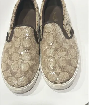 Coach signature logo slip-on sneakers featuring a brown 9B thumbnail 1