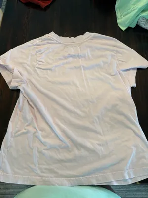 Super cute free people top it’s very worn. The pink is kind of washed out in the photo but not really in person. thumbnail 3