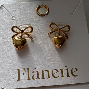 Gold Heart Bow Earrings thumbnail 1