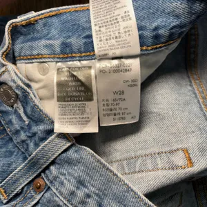 Levis 501 Original High Rise Distressed Denim Shorts Medium Wash Women's size 28 thumbnail 7