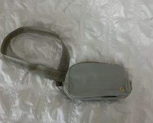 Lululemon Everywhere Belt Bag 1L Grey with Gold zippering thumbnail 1