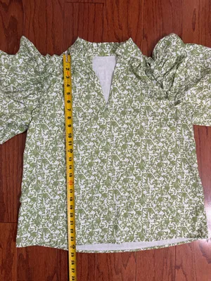 Green & white floral Boho Blouse with ruffled Puff sleeves- Size Medium. ***Refer to measurements. Gently warn and excellent condition. Measurements approximately 21” x 24” long. Material is 100% polyester. Non-smoking home . Priced at as is condition. Don’t like my price make a reasonable offer! And thank you for checking my closet! thumbnail 7