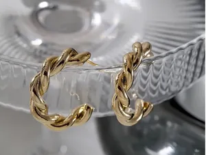 Gold twist hoop earrings thumbnail 1