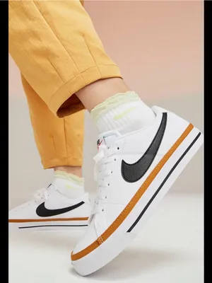 Nike White Sneakers with Black Swoosh and Orange Accent thumbnail 1