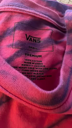 This is a pink and purple Vans tie-dye long-sleeve t-shirt featuring the brand's signature white logo on the chest. thumbnail 16