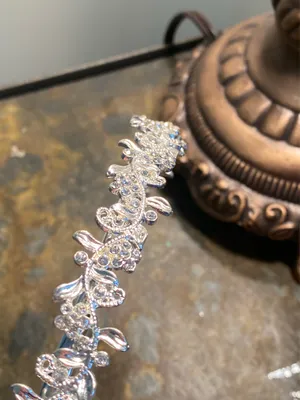 Silver metal headband with flowers and rhinestones on a vine thumbnail 9