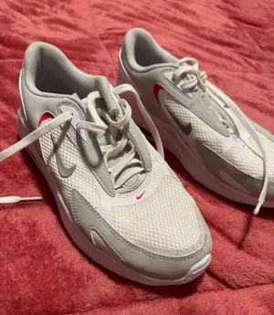 Nike Women's White and Light Gray Running Shoes with Red Swoosh thumbnail 1