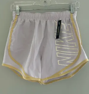 Nike Women’s Light Gray Athletic Shorts with Yellow Trim thumbnail 1
