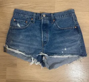 Levi's Distressed Mid-Blue Denim Cutoff Shorts thumbnail 1
