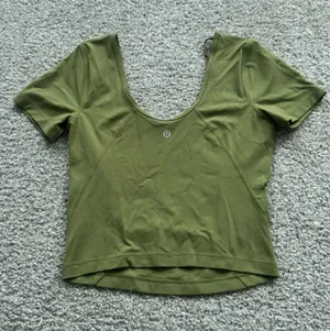 Lululemon Align Tee is featured in the color bronze green and is designed with buttery-soft Nulu fabric thumbnail 1