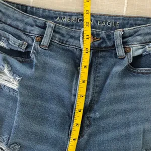 12 Long American Eagle Outfitters High-Rise Distressed Blue Mom Jeans thumbnail 11