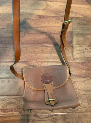 Dooney & Bourke Pebbled Leather Saddle Crossbody Bag thumbnail 1