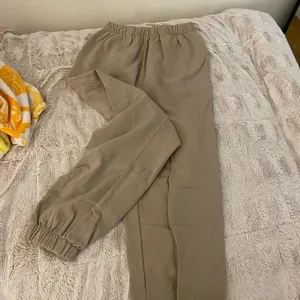 Brandy Melville john galt sweatpants, tan- one size thumbnail 1