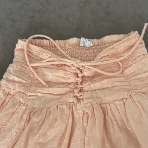 Cotton On skirt. Elastic waist with tie up front design. Color- peach. Size XXS thumbnail 2