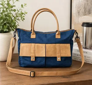 Blue Canvas Tote Bag with Tan Faux Leather Accents and Crossbody Strap thumbnail 1