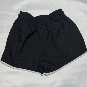 Nike Women's Black Athletic Shorts with White Piping thumbnail 4