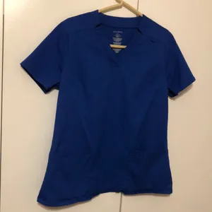 JAANUU Women’s Blue Nurse Hospital Scrub Top Size Medium thumbnail 1