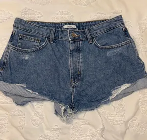 Forever 21 Distressed Dark Blue Denim Cutoff Shorts thumbnail 1