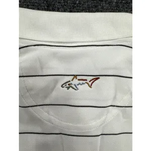 Greg Norman Play Dry Golf Polo Shirt White Black Stripe Women’s Medium NWT thumbnail 6