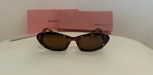 Miu Miu Sunglasses Cat-Eye thumbnail 1