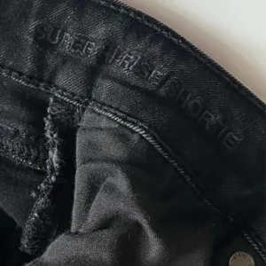 American Eagle • Distressed Washed Black Button Fly Super High Rise Shorties thumbnail 5