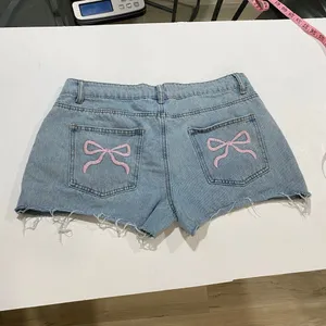 Edikted Size L Light Wash Denim Shorts Pink Bow Y2K Coquette Cutoff thumbnail 4
