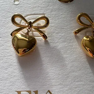 Gold Heart Bow Earrings thumbnail 2