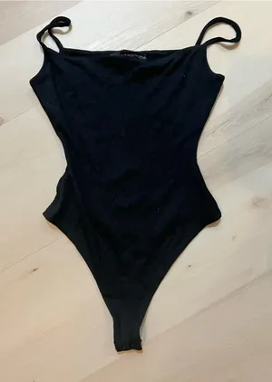 Naked Wardrobe NEW Women Black Spaghetti Strap Ribbed Knit Bodysuit thumbnail 1