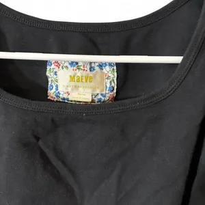 Anthropologie Maeve black top with puffy sleeves thumbnail 2