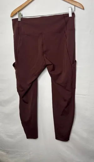 Arc’teryx brown pull on workout leggings with pockets on both sides sz Lg thumbnail 1