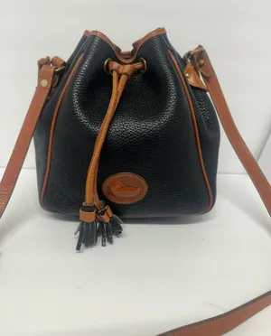Dooney & Bourke Black Pebbled Leather Drawstring Bucket Bag with Tan Trim thumbnail 1