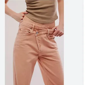 NWOT AGOLDE X FREE PEOPLE Pink Salt Criss-Cross Upsized Jeans thumbnail 1