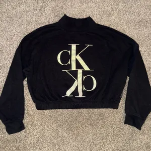 Calvin Klein Jeans Women's Black Cropped Mock Neck Sweatshirt with Monogram Logo thumbnail 1
