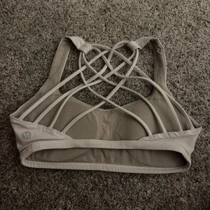 white lulu sports bra! barely worn, great condition! size 0! comes with pads! originally $48, selling for $25! ! thumbnail 2