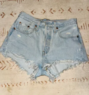 Levi’s 501 Light-Wash Distressed Denim Shorts thumbnail 1