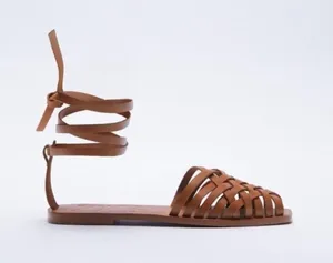 Zara tan leather sandals featuring a woven strap design and ankle laces thumbnail 1