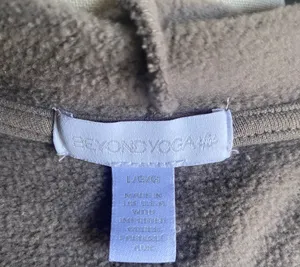 Beyond Yoga-On the go-Cozy Taupe Jacket-size large The first three stock photos are the actual color of the jacket, I had a hard time capturing the exact color in my pictures. Soft and warm taupe jacket. Ideal for comfort and style Open front Cinched waist Hooded Side pockets 67% cotton and 33% polyester Excellent condition thumbnail 12
